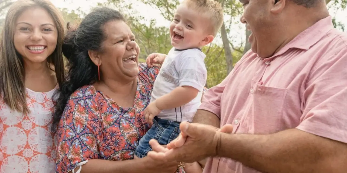 Multigenerational Aboriginal family smiling together outdoors